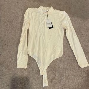 Knix the birds papaya mockneck bodysuit collab